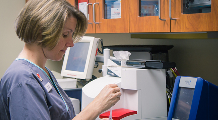 vet tech working on diagnostic samples